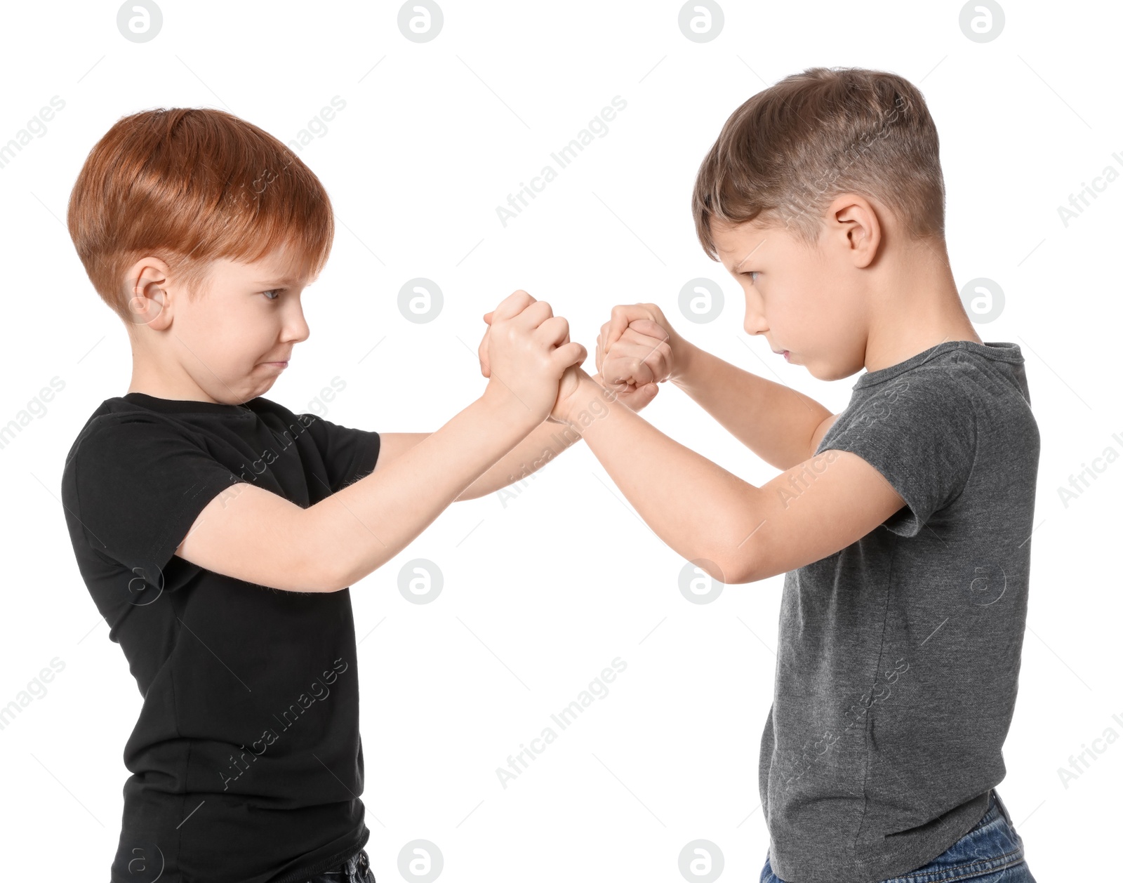 Photo of Two boys fighting on white background. Children's bullying