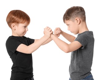 Two boys fighting on white background. Children's bullying