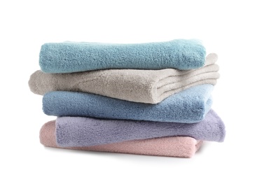 Photo of Stack of clean soft towels on white background