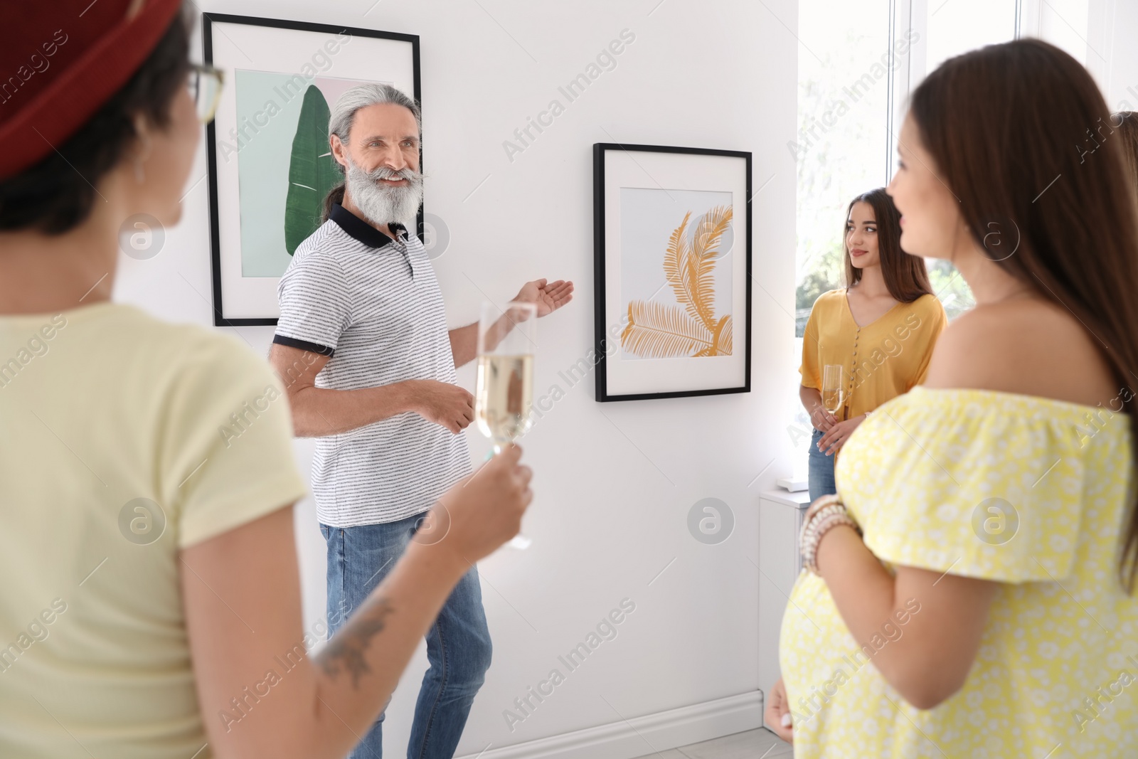 Photo of Group of people with guide at exhibition in art gallery