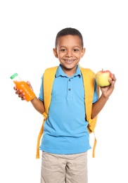 African-American schoolboy with healthy food and backpack on white background