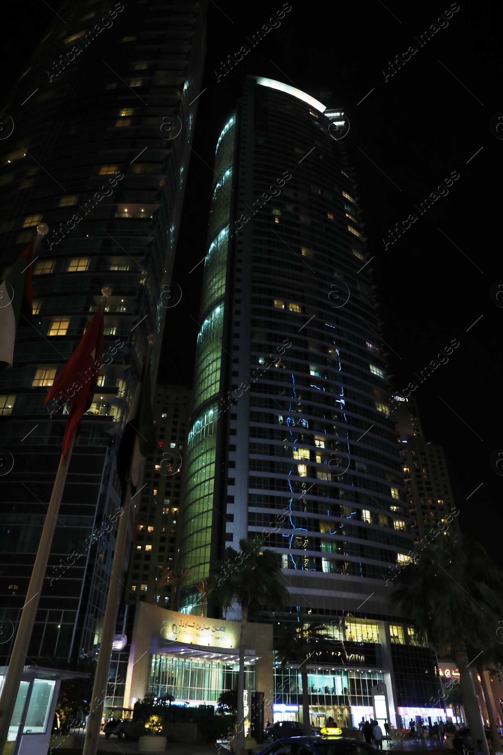 Photo of DUBAI, UNITED ARAB EMIRATES - NOVEMBER 03, 2018: Night cityscape with skyscrapers