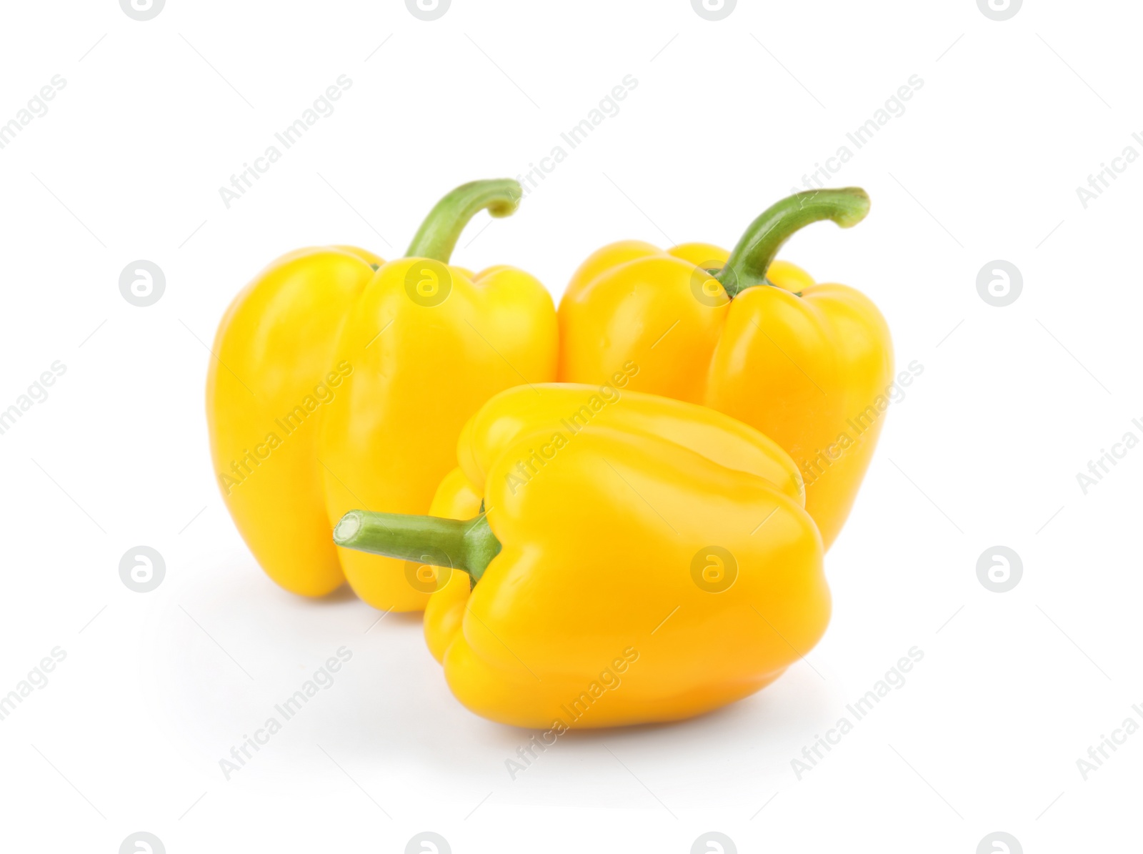 Photo of Ripe yellow bell peppers isolated on white