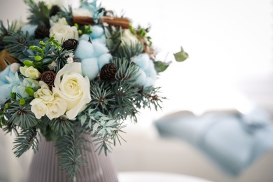 Photo of Beautiful wedding winter bouquet indoors, closeup. Space for text