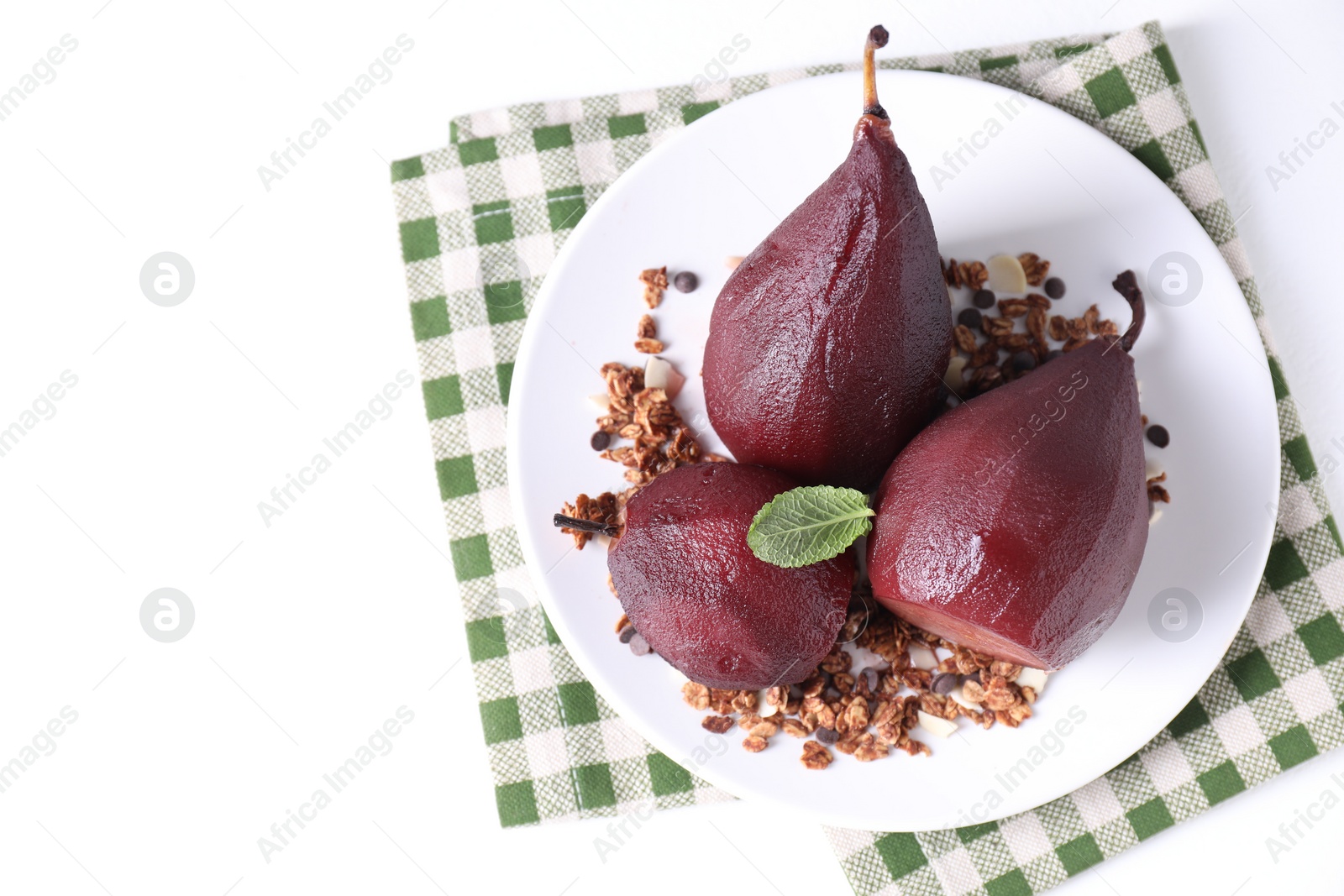 Photo of Tasty red wine poached pears with muesli on white table, top view. Space for text