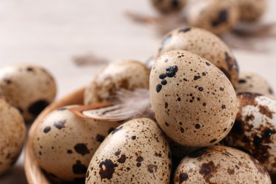 Photo of Many fresh quail eggs on table, closeup