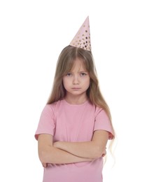 Unhappy little girl in party hat with crossed arms on white background