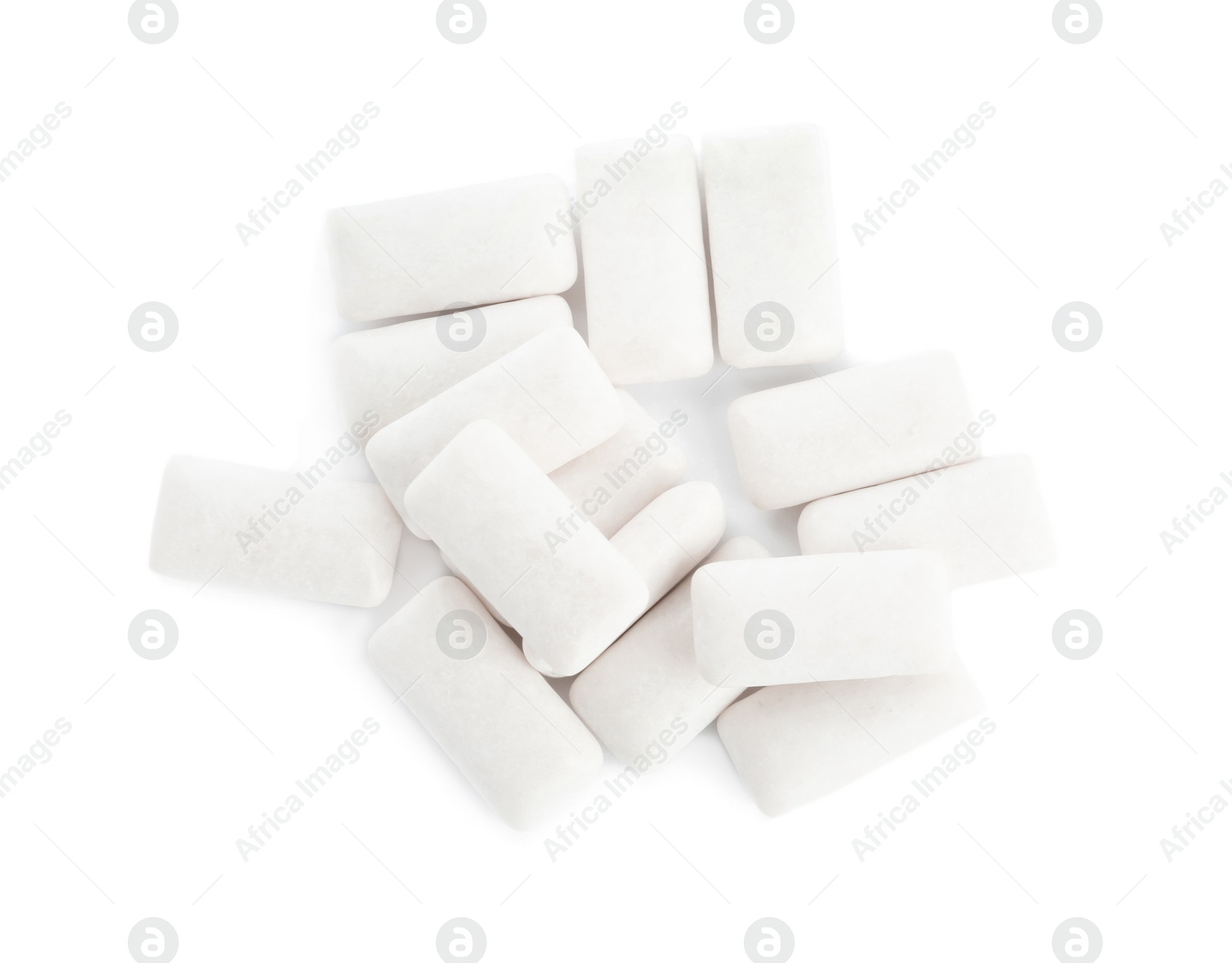 Photo of Heap of chewing gum pieces on white background, top view