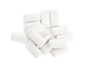 Heap of chewing gum pieces on white background, top view