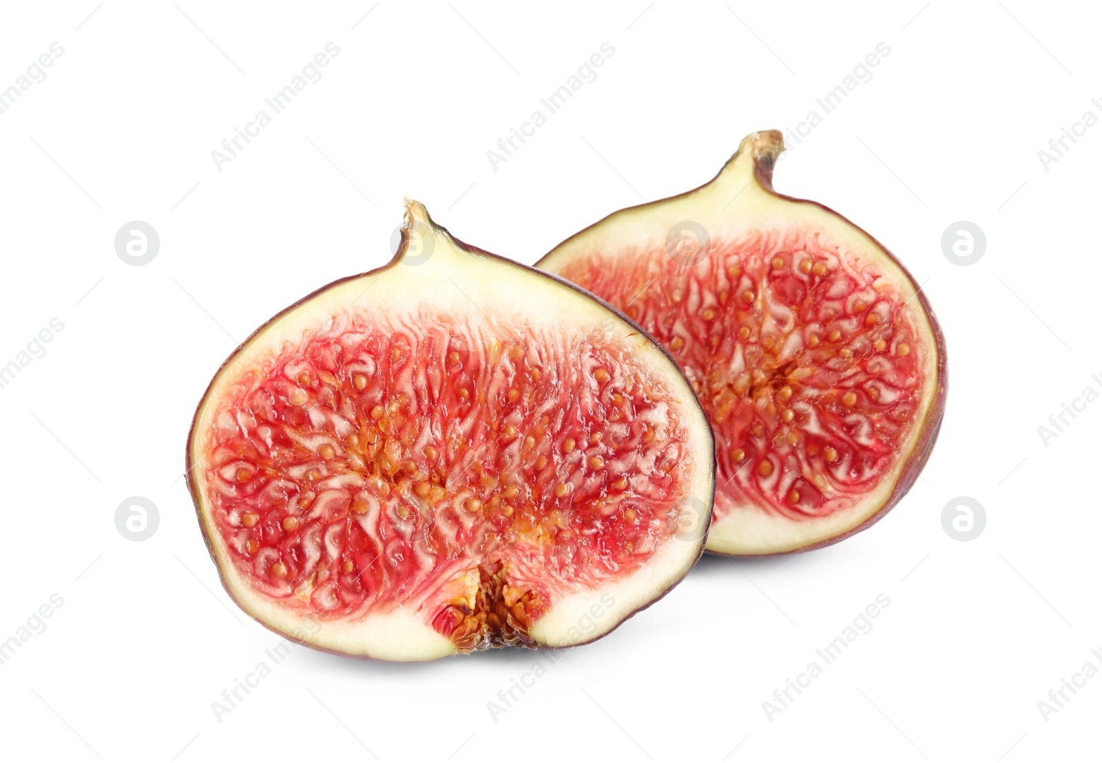 Photo of Halves of fresh fig fruit on white background