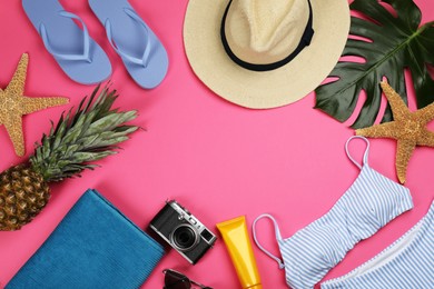 Photo of Frame of beach objects on pink background, flat lay. Space for text