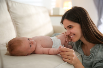 Photo of Mother with her newborn baby at home