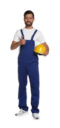 Photo of Professional builder in uniform with hard hat isolated on white