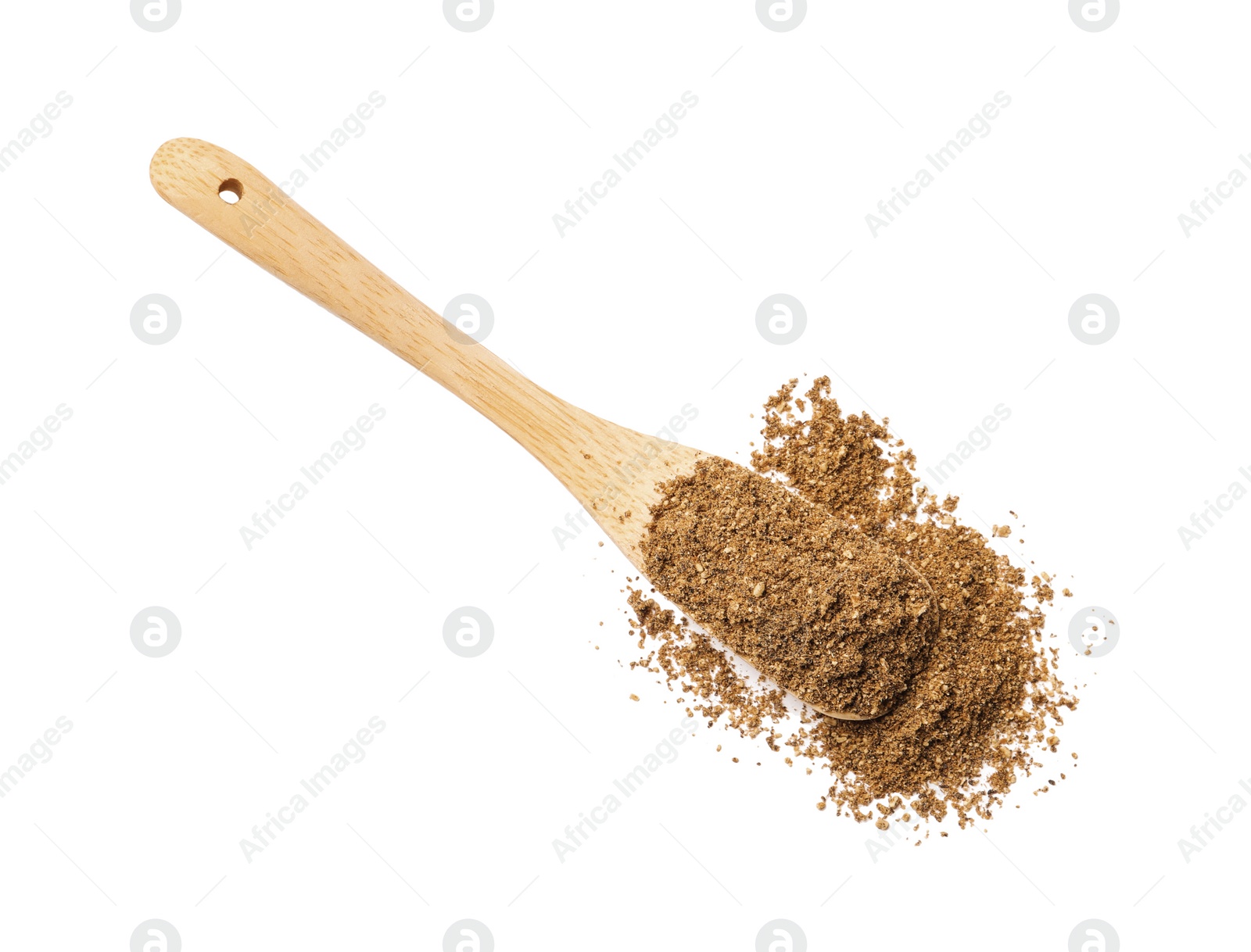Photo of Wooden spoon of aromatic caraway (Persian cumin) powder isolated on white, top view