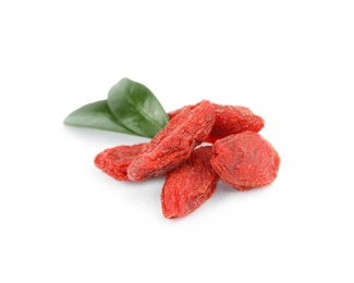 Photo of Dried goji berries and leaves on white background