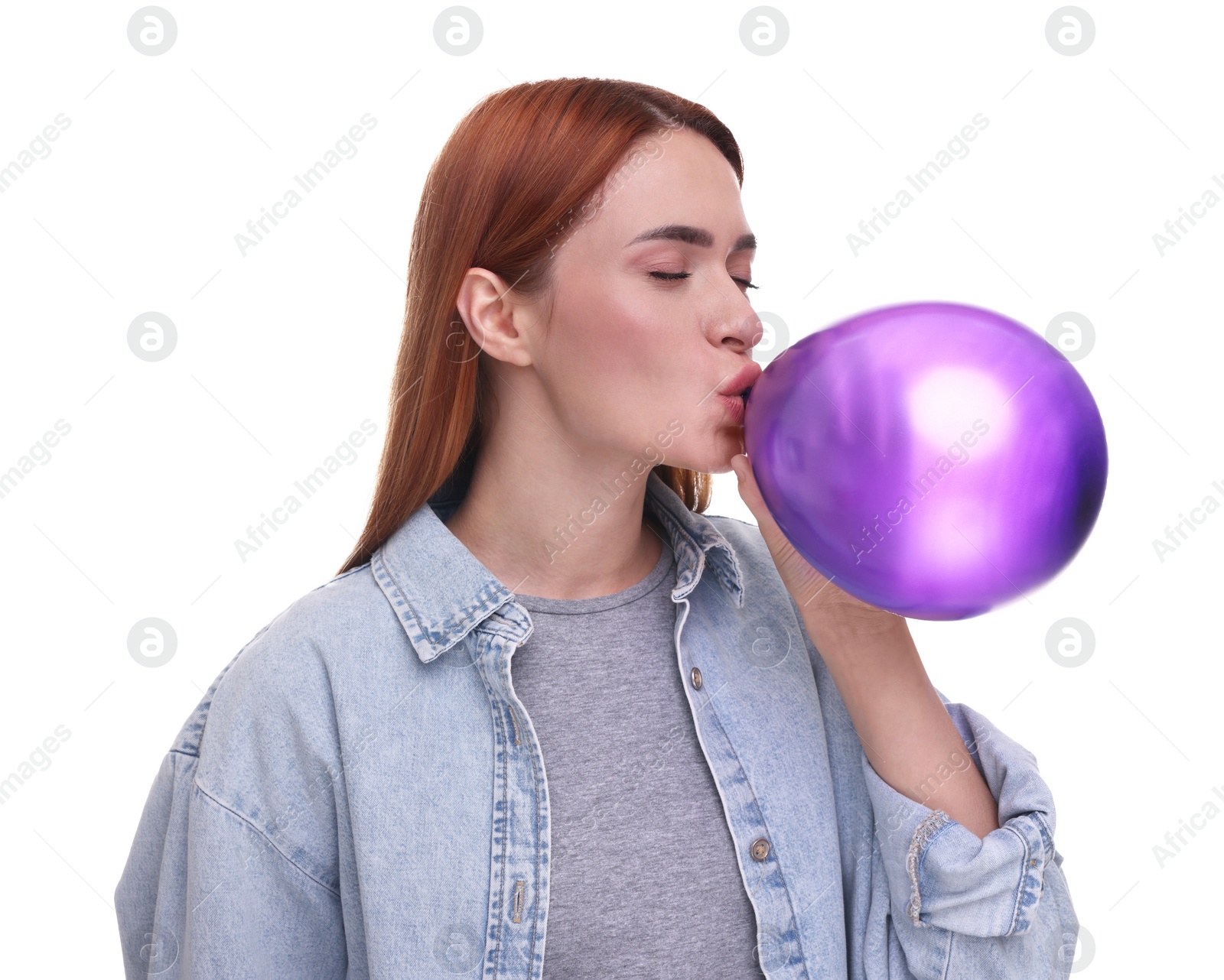 Photo of Woman inflating purple balloon on white background