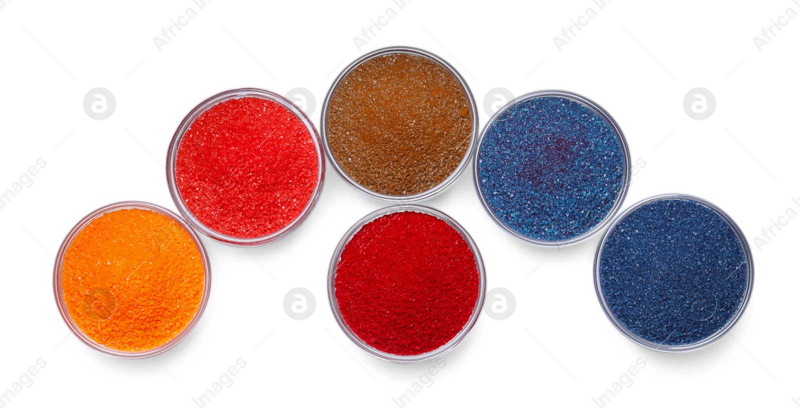 Photo of Glass bowls with different food coloring isolated on white, top view