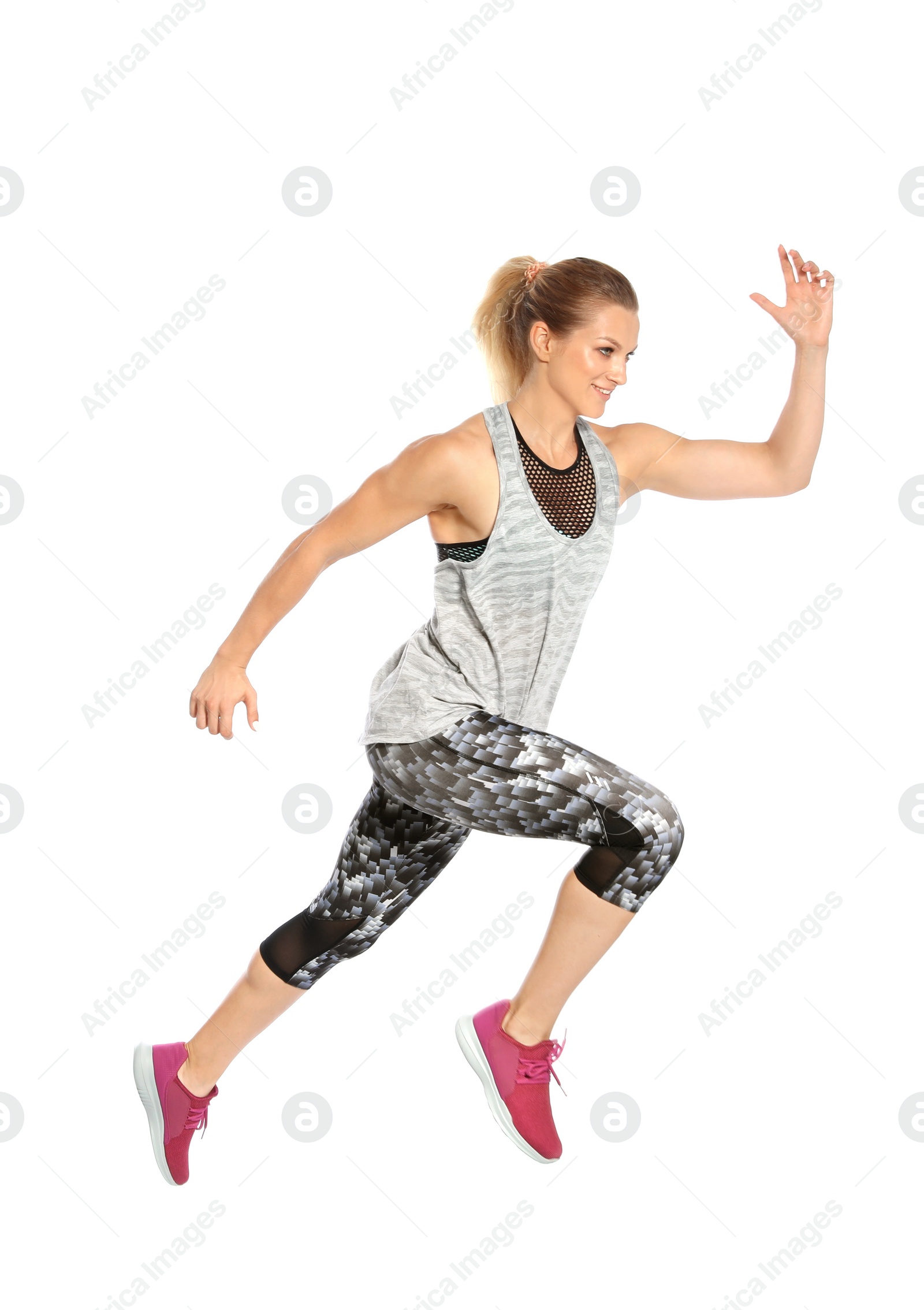 Photo of Sporty young woman running on white background