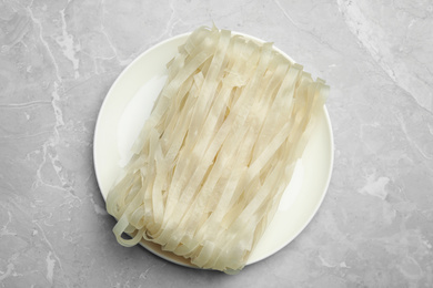 Photo of Block of rice noodles on light grey marble table, top view