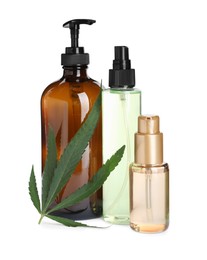 Photo of Set of hemp cosmetics with green leaf isolated on white
