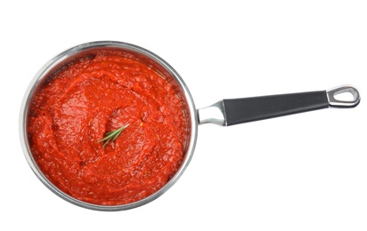 Photo of Delicious tomato sauce in pan isolated on white, top view
