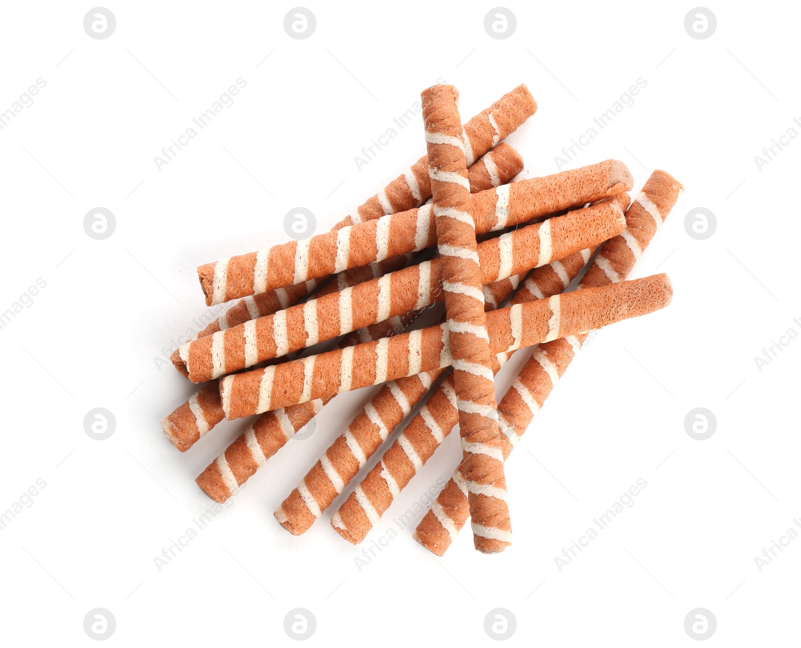 Photo of Delicious chocolate wafer rolls on white background, top view. Sweet food