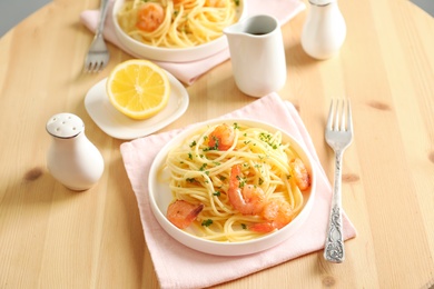 Photo of Delicious pasta with shrimps on plate