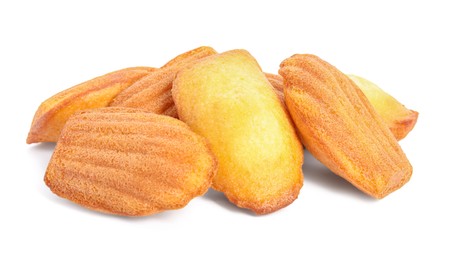 Photo of Pile of delicious madeleine cakes on white background