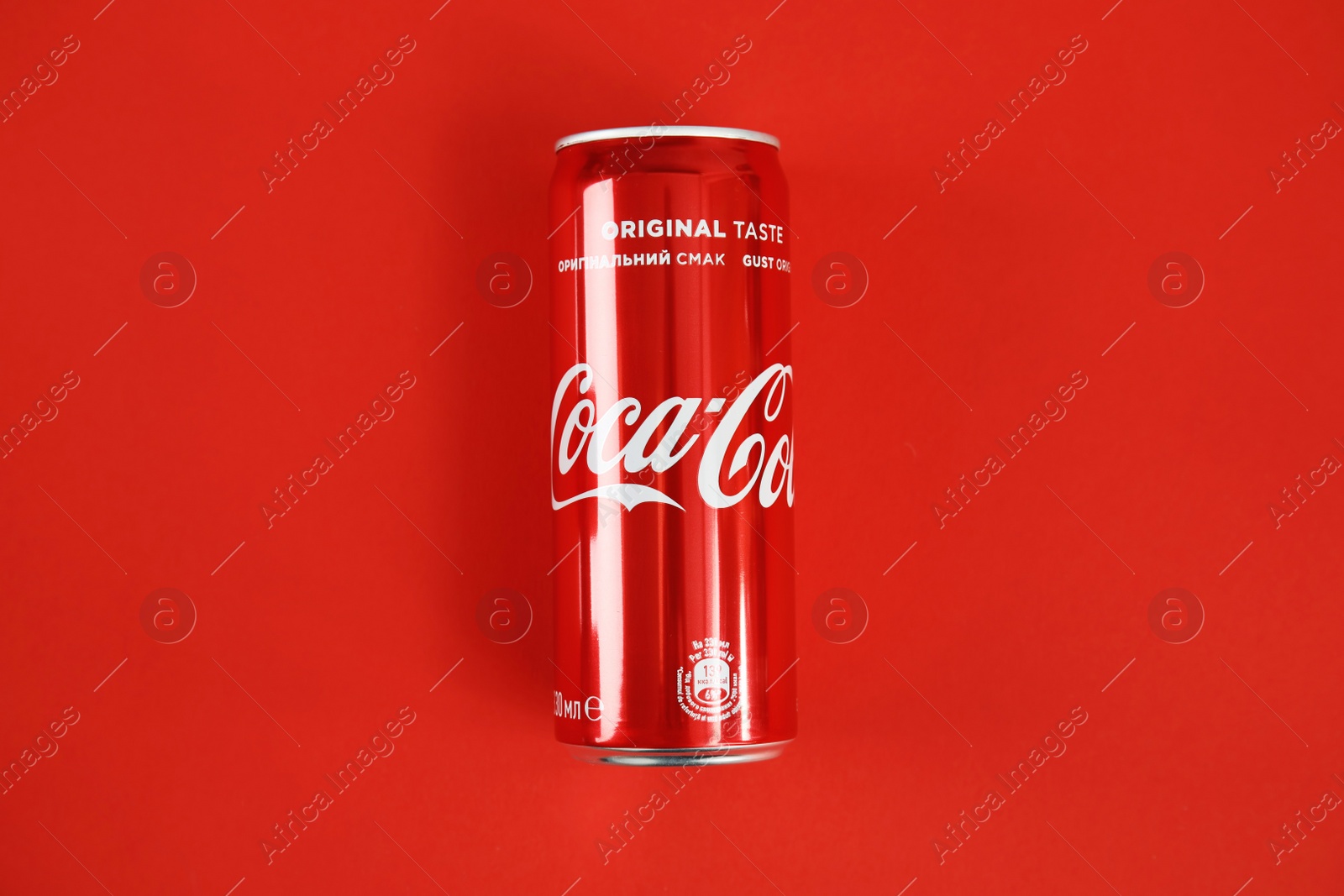 Photo of MYKOLAIV, UKRAINE - NOVEMBER 14, 2018: Coca-Cola can on color background, top view