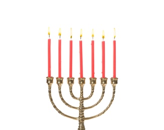 Photo of Golden menorah with burning candles on white background