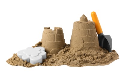 Beautiful sand castle and plastic beach toys isolated on white. Outdoor play