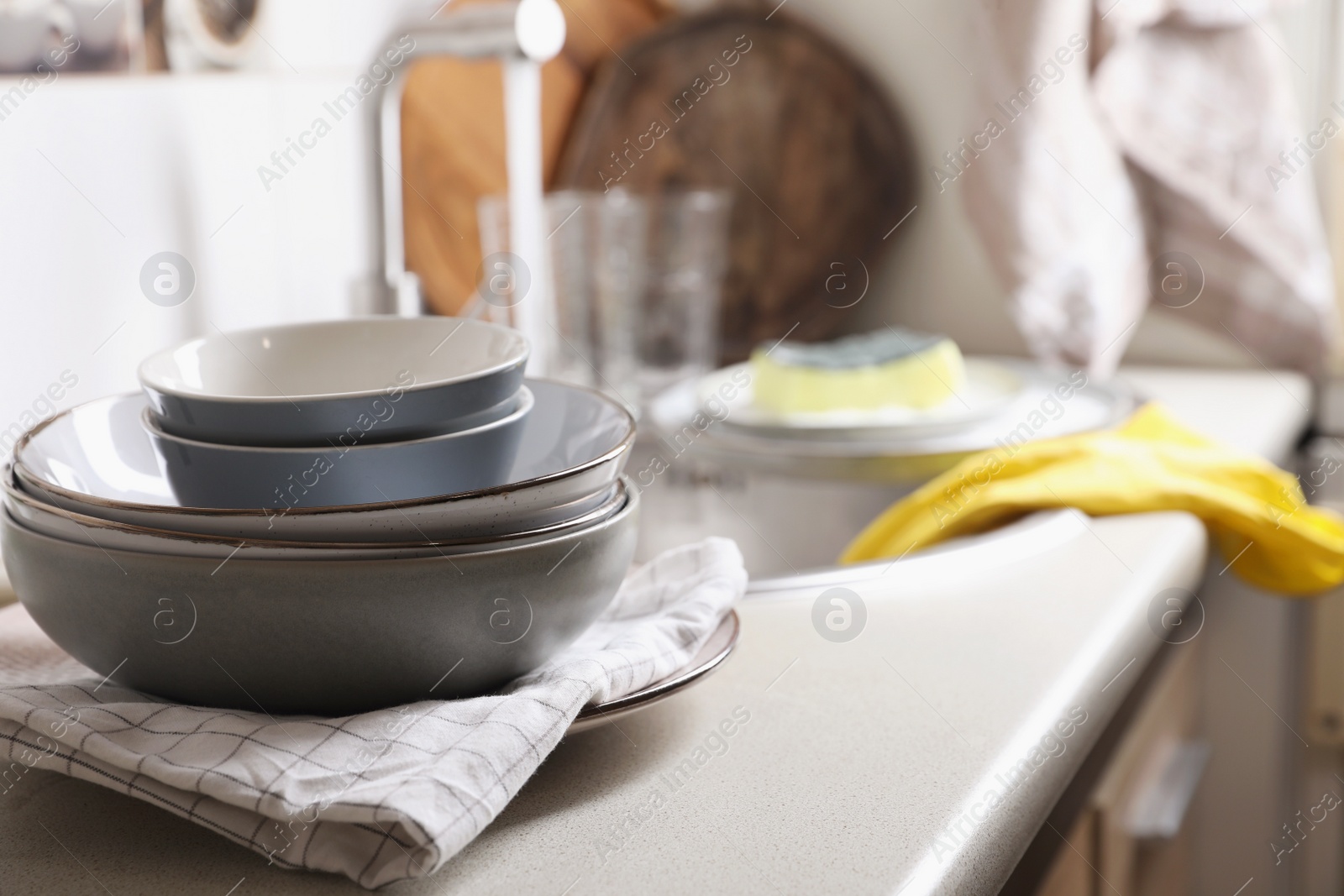 Photo of Clean bowls near kitchen sink. Washing dishes