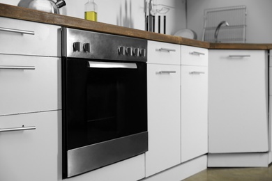 Modern electric oven in kitchen. Domestic appliance