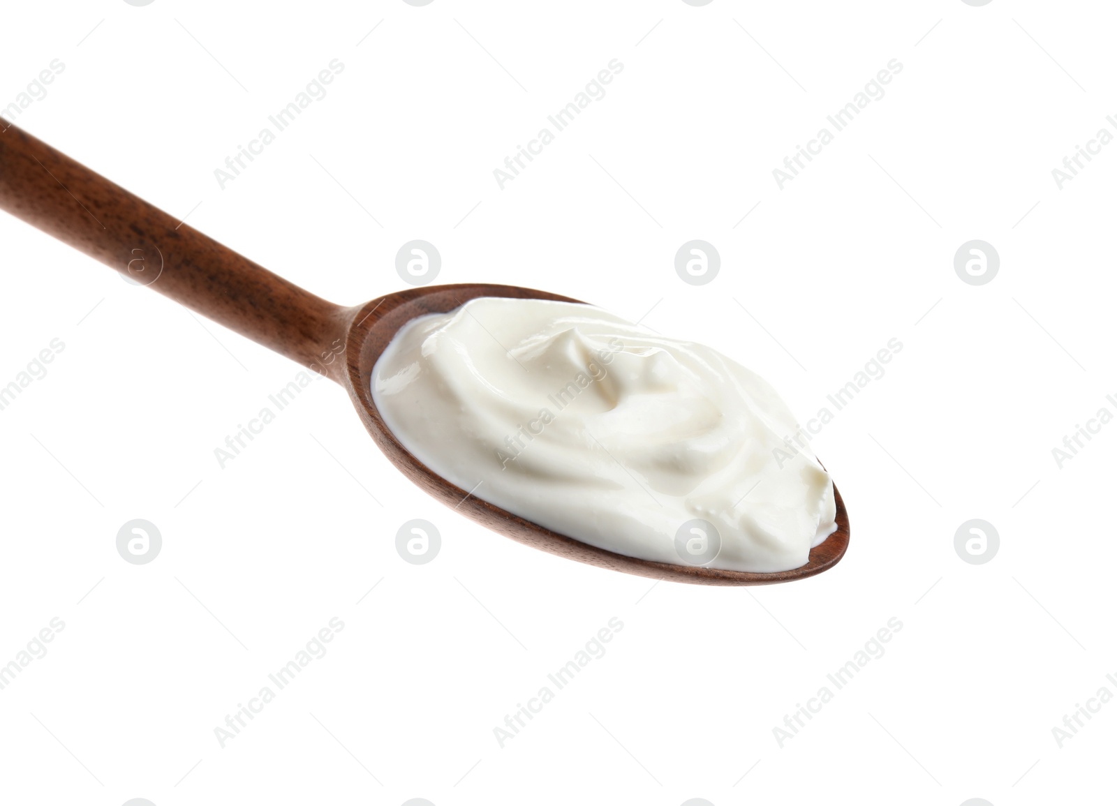 Photo of Wooden spoon with sour cream on white background