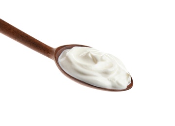 Wooden spoon with sour cream on white background