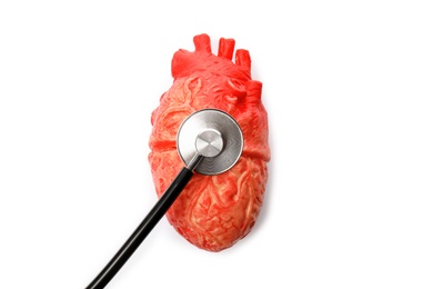 Photo of Heart model and stethoscope on white background, top view. Cardiology concept