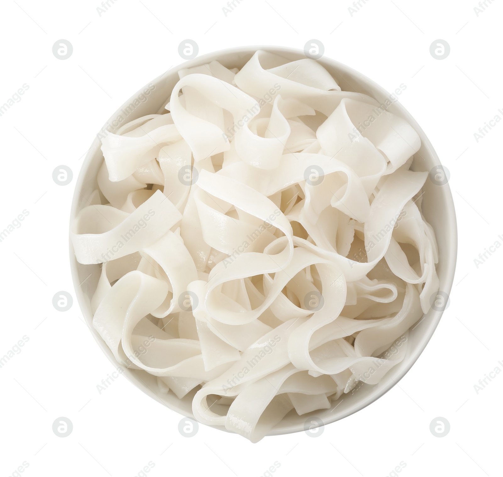 Photo of Bowl with rice noodles isolated on white, top view