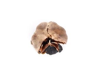 Photo of One bulb of fermented black garlic isolated on white, top view