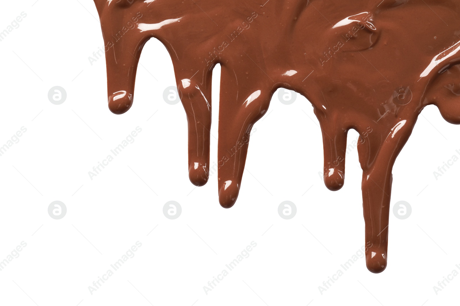 Photo of Tasty melted milk chocolate pouring down on white background