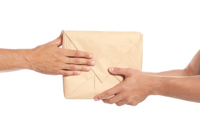 Photo of Courier giving parcel to client on white background, closeup