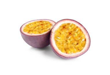 Photo of Halves of delicious passion fruit (maracuya) on white background