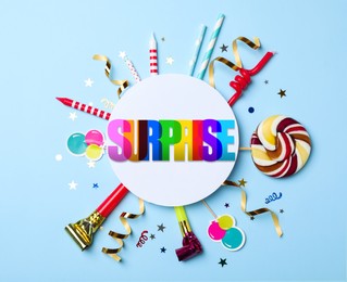 Image of Flat lay composition with different items for surprise party on light blue background