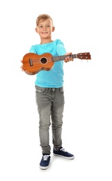 Photo of Little boy showing guitar, isolated on white