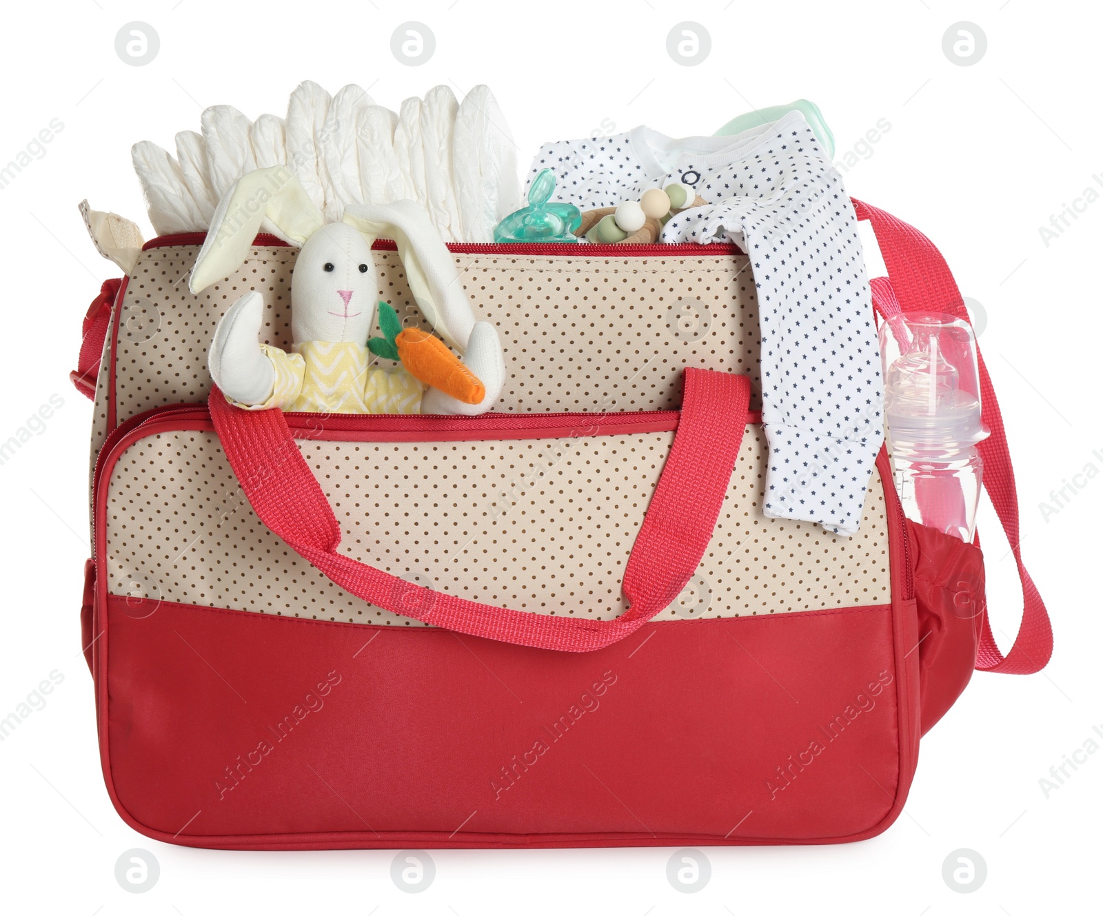 Photo of Mother's bag with baby's stuff isolated on white