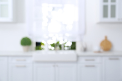 Photo of Blurred view of modern stylish kitchen interior