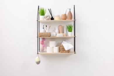 Photo of Different bath accessories, personal care products and artificial plants indoors