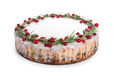 Traditional Christmas cake decorated with rosemary and cranberries isolated on white