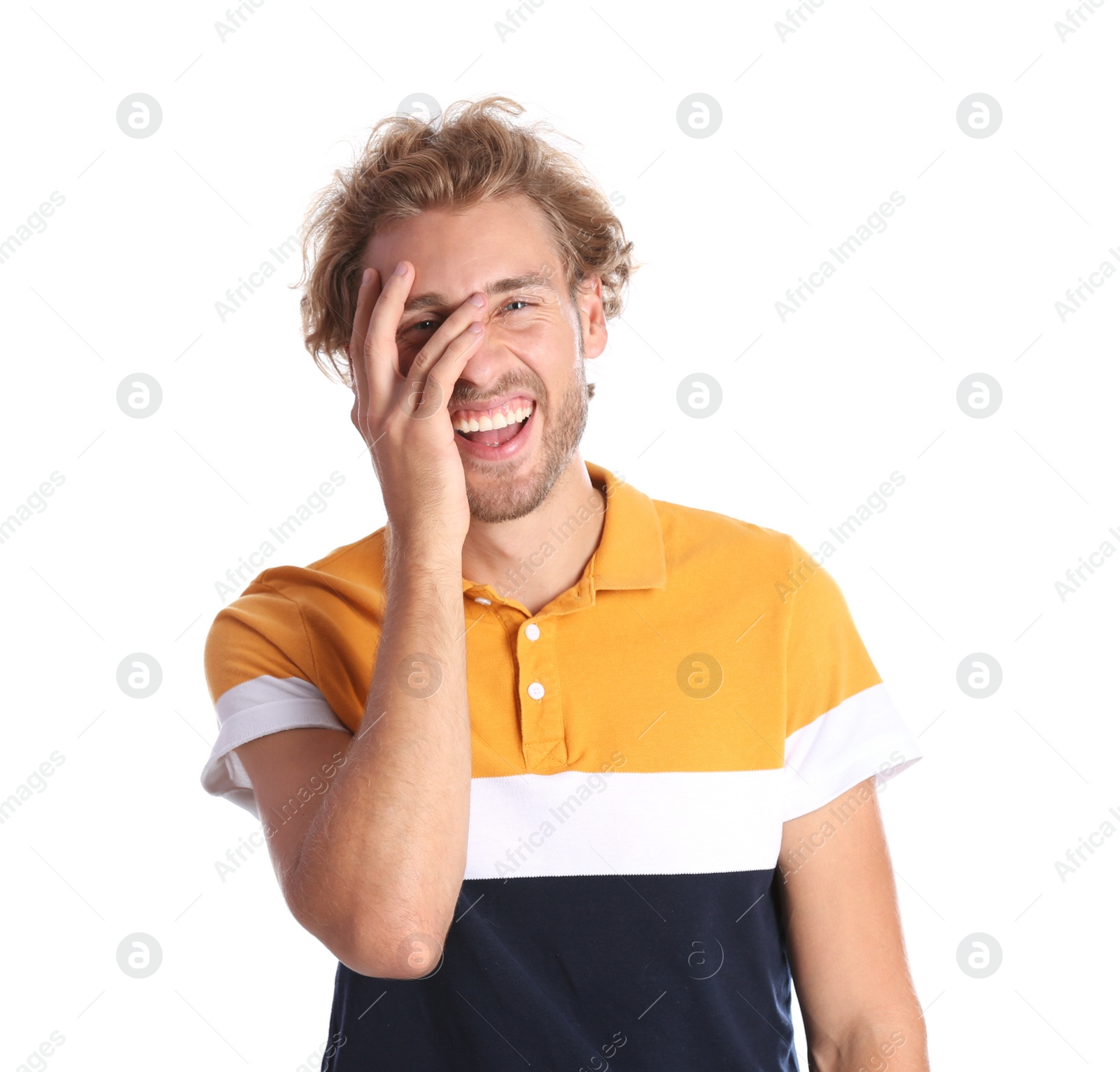 Photo of Handsome young man laughing on white background