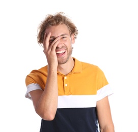 Photo of Handsome young man laughing on white background