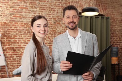 Photo of Portrait of happy employees in office. Team work